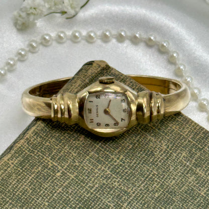 Vintage 10k gold filled Benrus Swiss manual winding cuff watch with unique safety clasp.