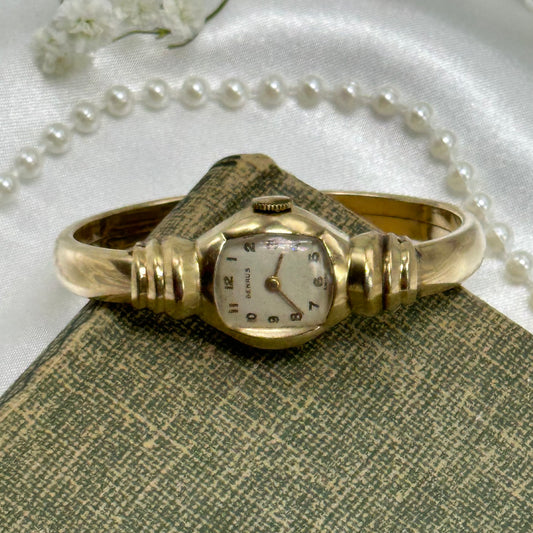 Vintage 10k gold filled Benrus Swiss manual winding cuff watch with unique safety clasp.
