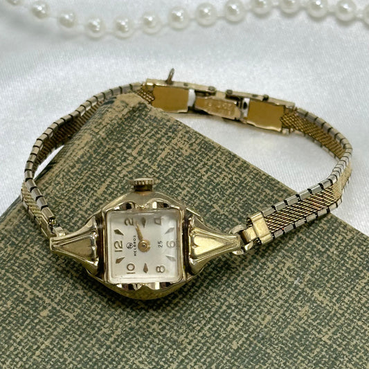 Vintage 10k rolled gold plated manual winding Helbros 25 jewels watch with elegant 10k gold filled clasp band.