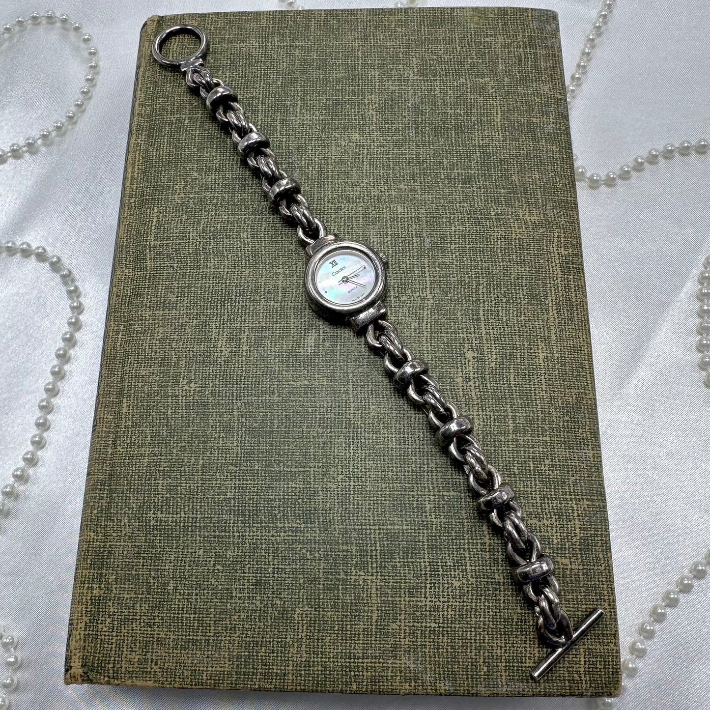 Vintage 5 microms sterling silver Cardini watch with unique chain bracelet band and quartz movement. Dial is mother of pearl.