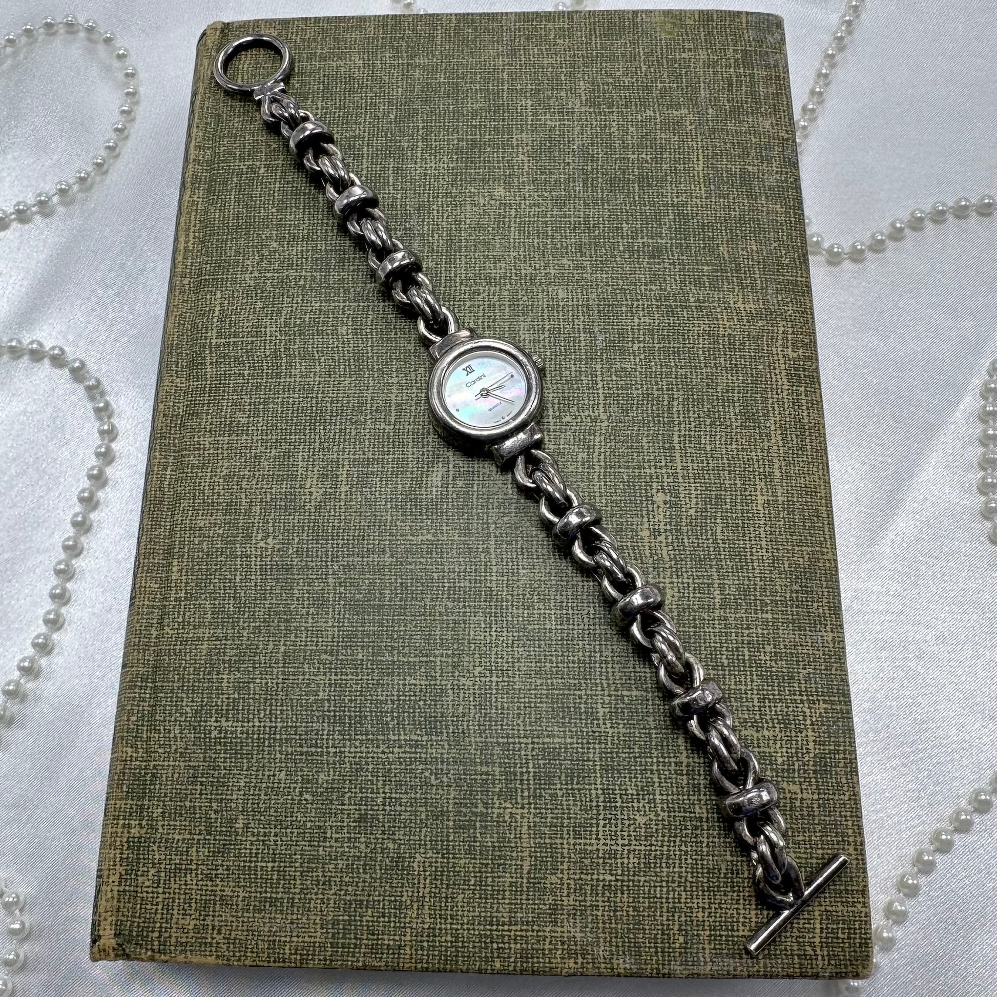 Vintage 5 microms sterling silver Cardini watch with unique chain bracelet band and quartz movement. Dial is mother of pearl.