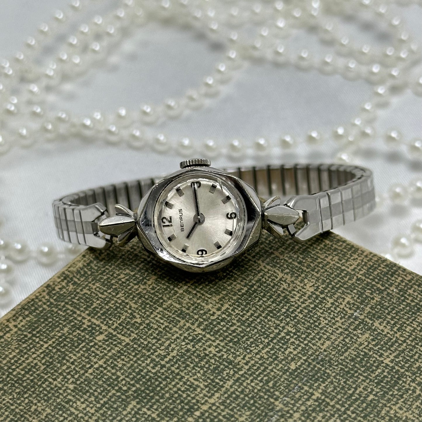 Vintage Benrus 10k rolled gold-plated manual winding cocktail watch from the 1960's with stretchable band. Watch comes with original B crown.