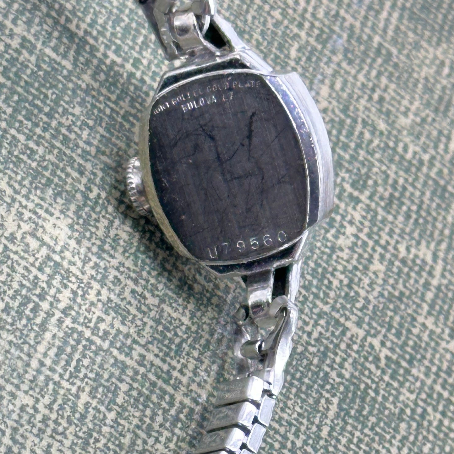 Vintage Bulova 10k rolled gold-plated manual winding watch with blue hands and stretchable band from the 1950