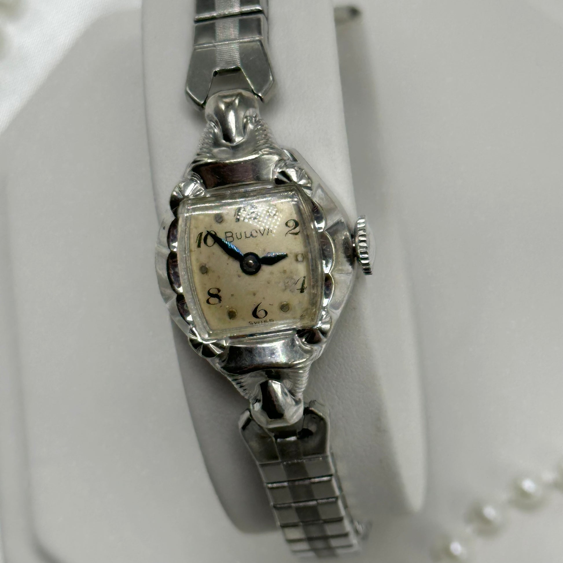 Vintage Bulova 10k rolled gold-plated manual winding watch with blue hands and stretchable band from the 1950's.&nbsp;