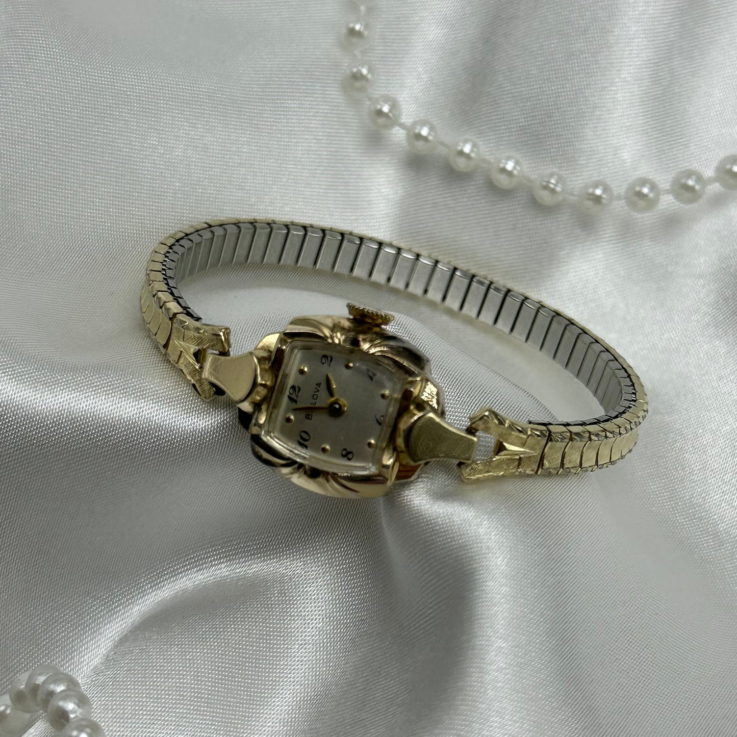 Vintage Bulova 10k rolled gold-plated manual winding watch with stretchable band. Watch comes with original BULOVA crown.