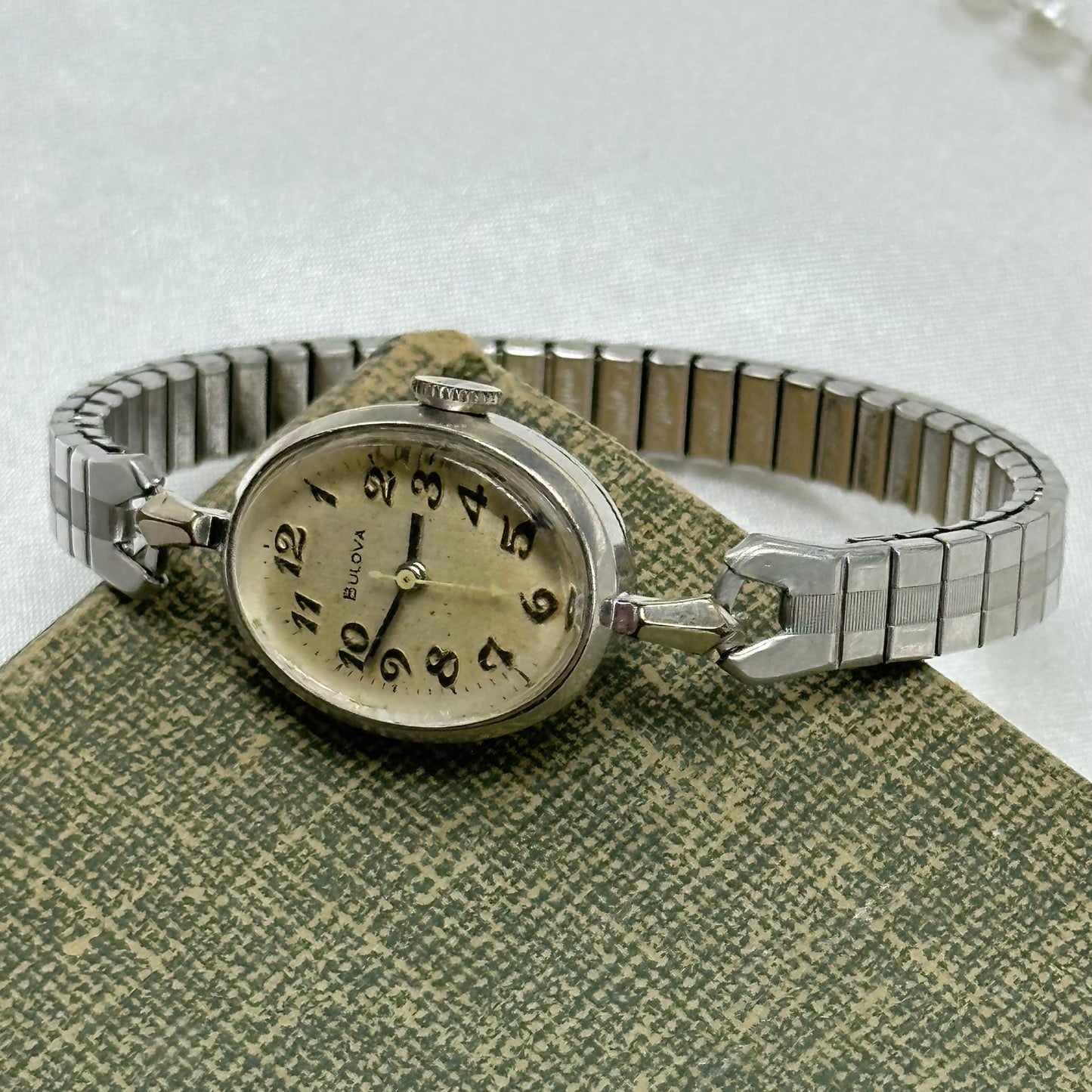 Vintage Bulova 10k rolled gold-plated manual winding watch with stretchable band from the 1970s. Watch comes with original BULOVA crown.&nbsp;