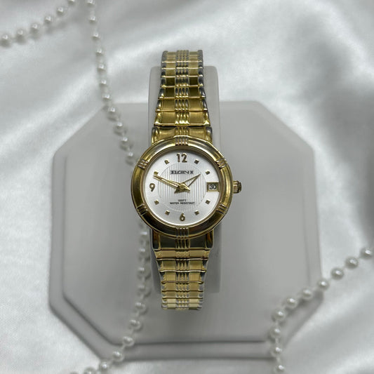 Vintage Elgin II water resistant watch with date display and stretchable band