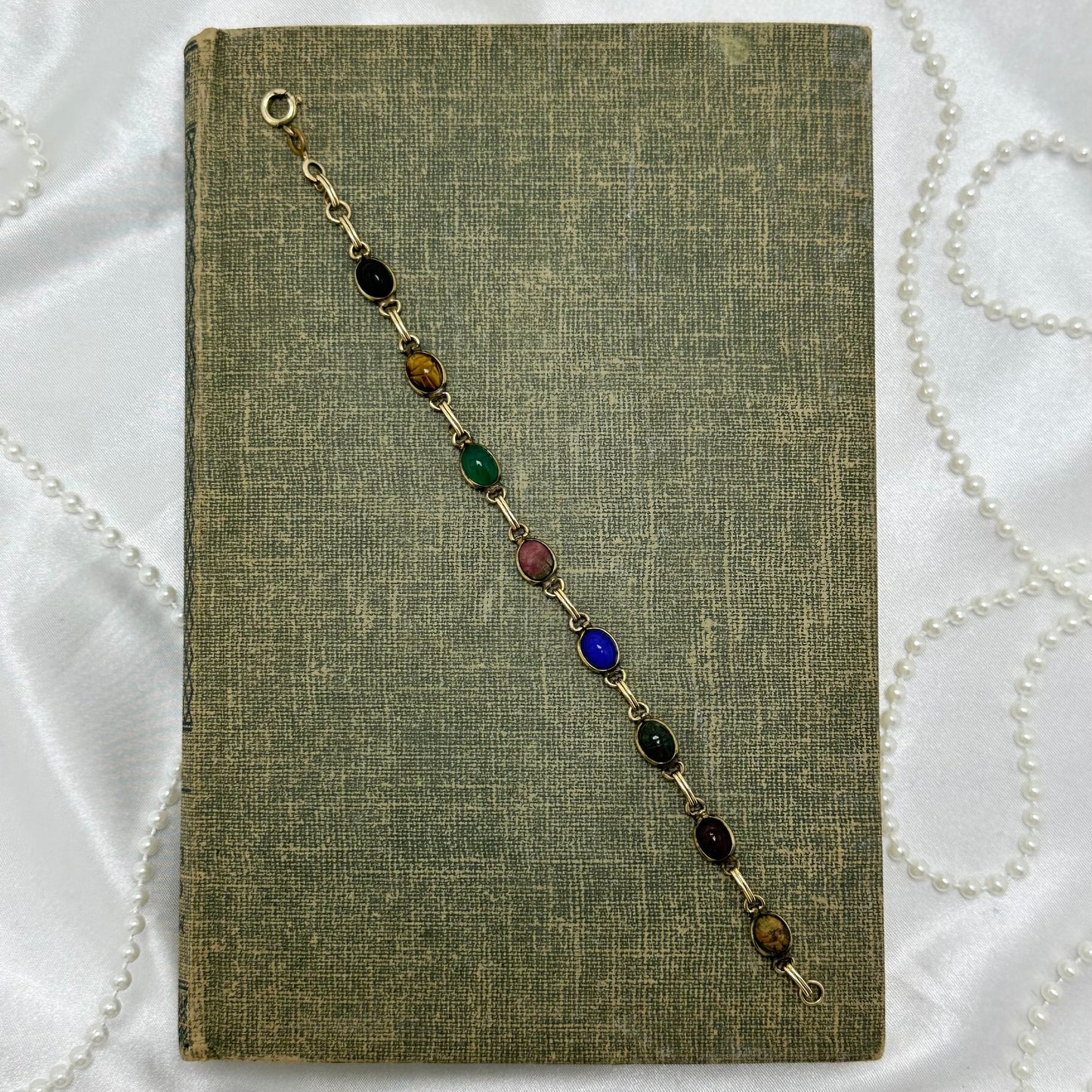 Dainty vintage gold tone bracelet with multicolor scarabs.
