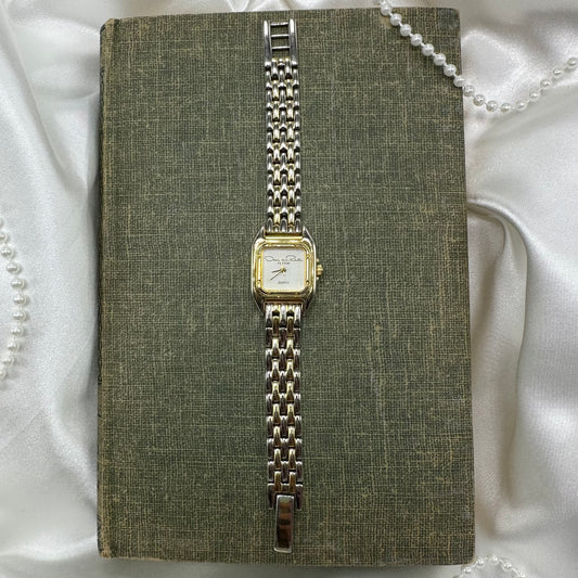 Vintage Oscar De La Renta Parfums watch with quartz movement