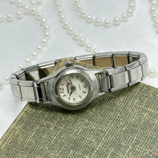 Vintage Y2K silver tone Claire's watch with stretchable band and quartz movement.