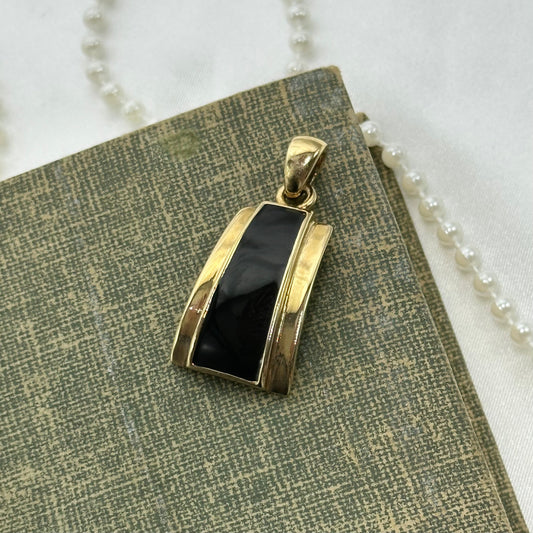 Vintage black and gold tone Lia Sophia charm pendant.