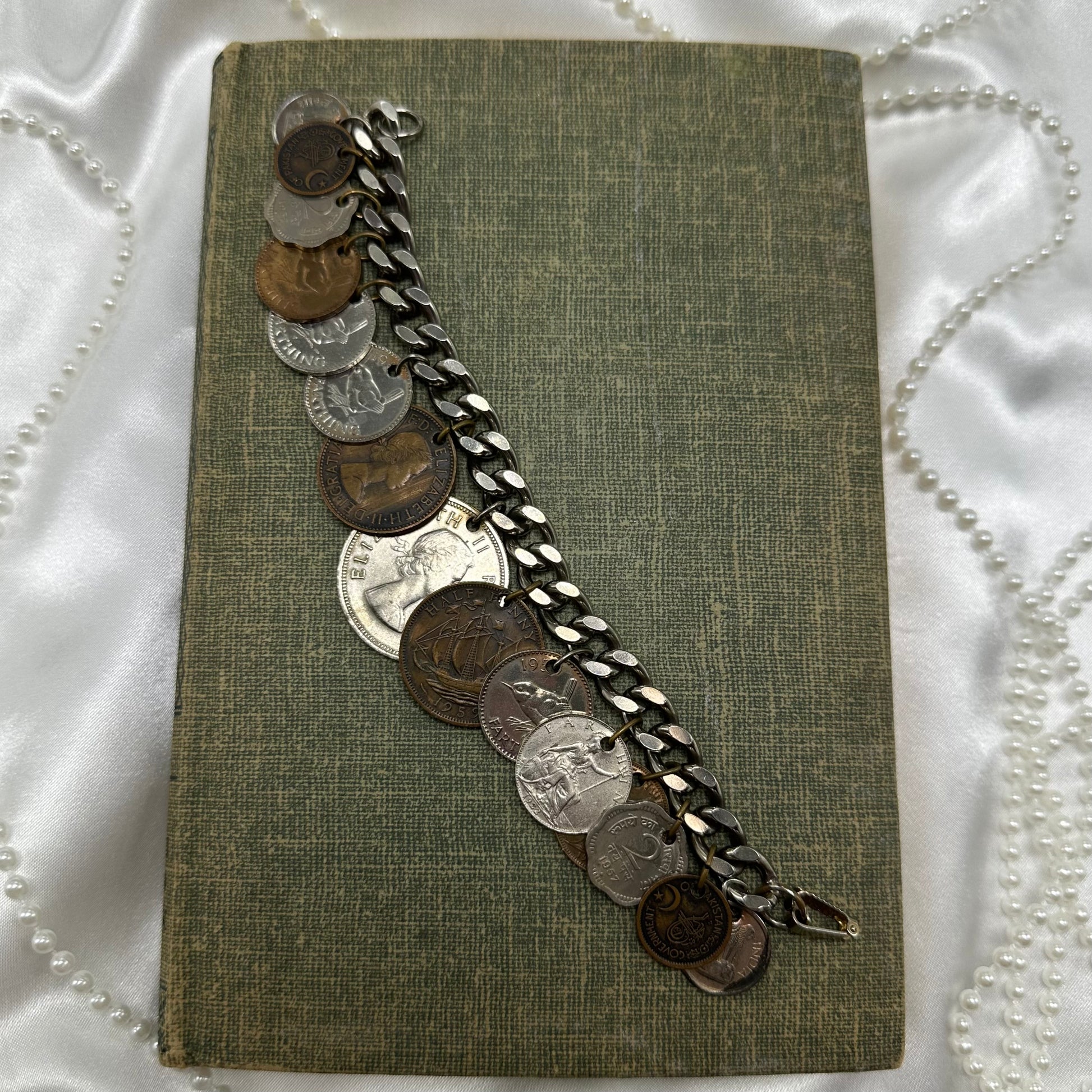 Vintage charm style coin bracelet. Coins are from various countries and date around the 1950's.