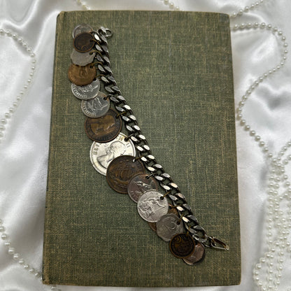 Vintage charm style coin bracelet. Coins are from various countries and date around the 1950's.