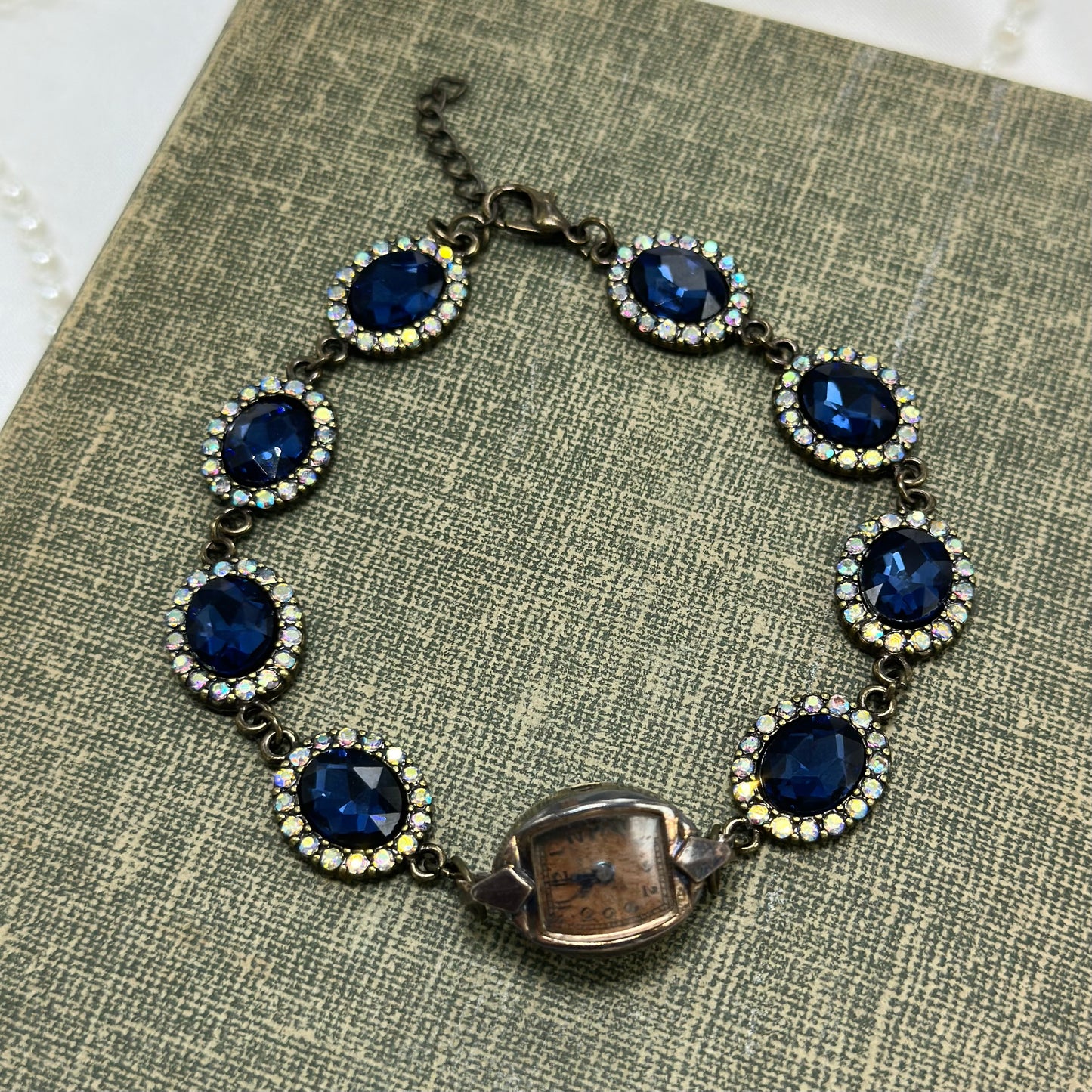 Vintage copper tone watch with blue stone chain bracelet. Watch does not run.