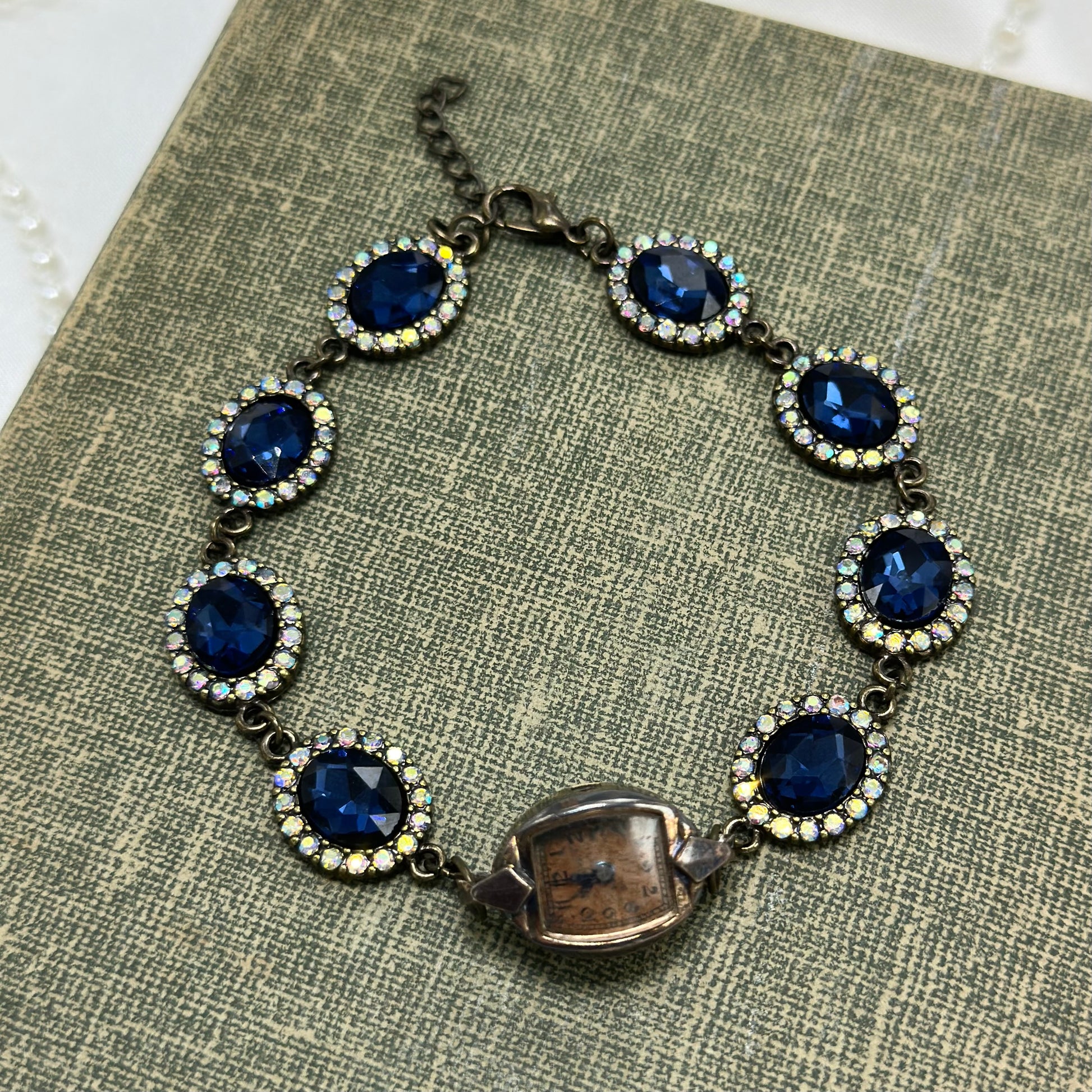 Vintage copper tone watch with blue stone chain bracelet. Watch does not run.