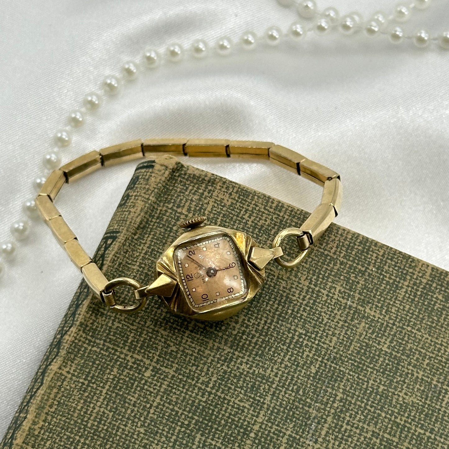 Vintage gold and rose gold tone Helbros manual winding watch with 10k gold filled stretchable band.