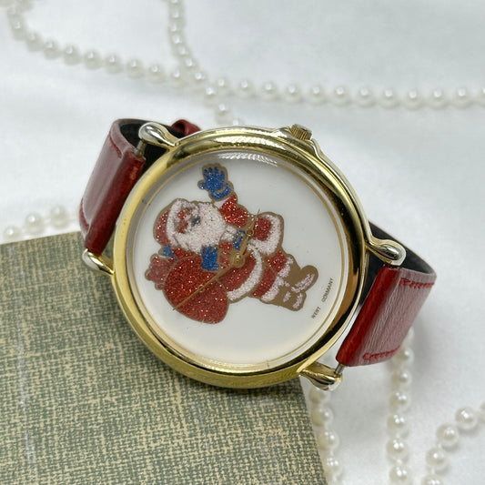 Vintage gold tone Santa watch with glitter dial and red leather band.2