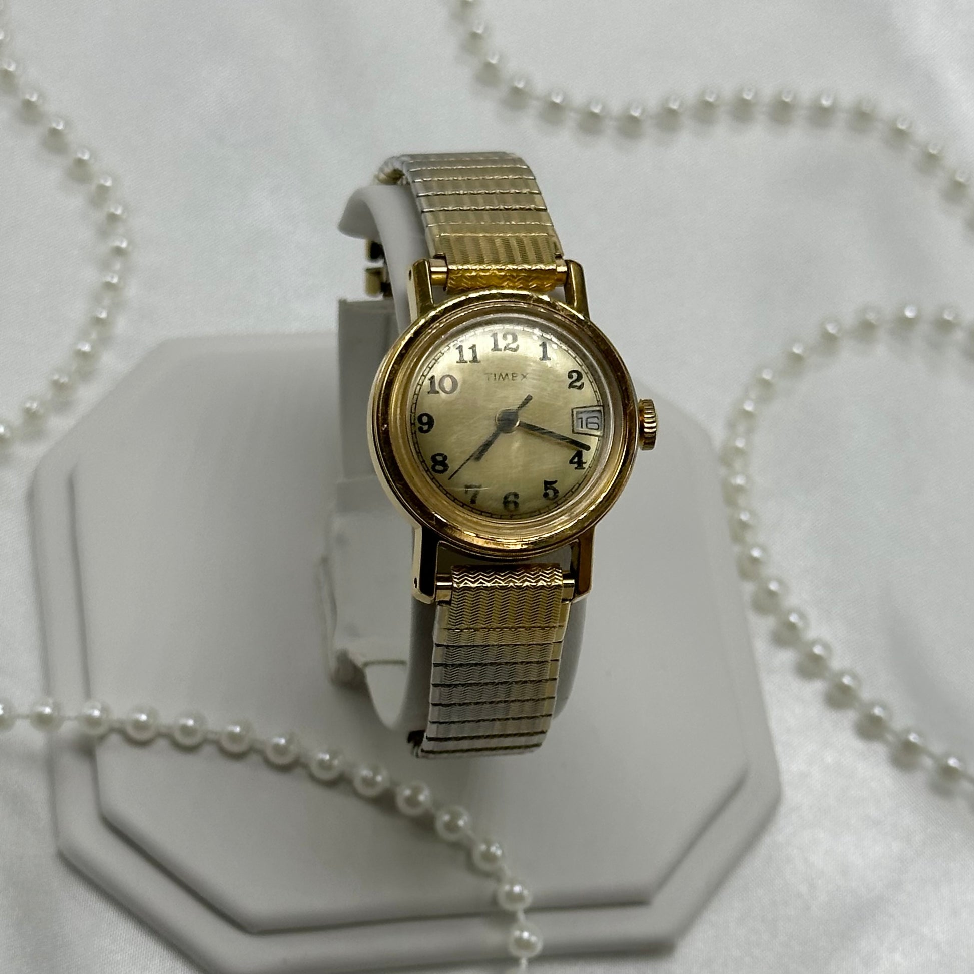 Vintage gold tone Timex manual winding watch with date display