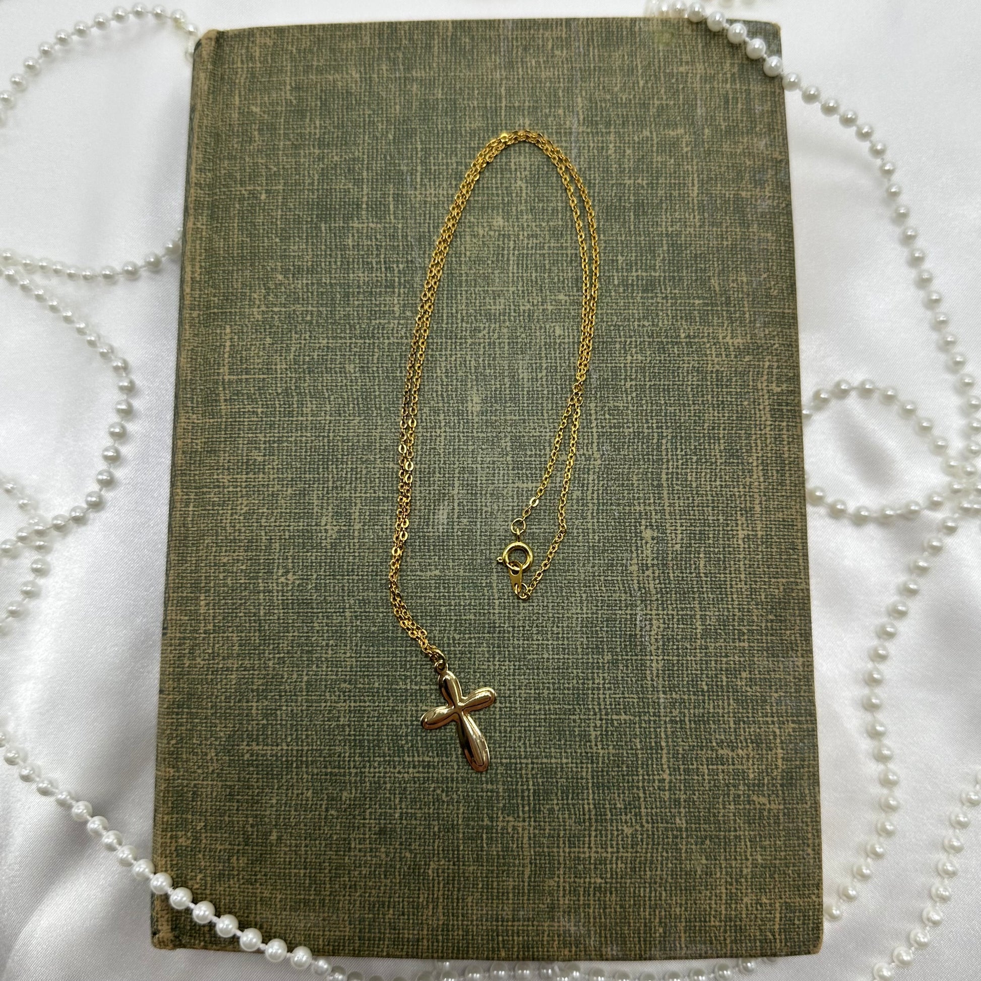Vintage gold tone cross necklace.
