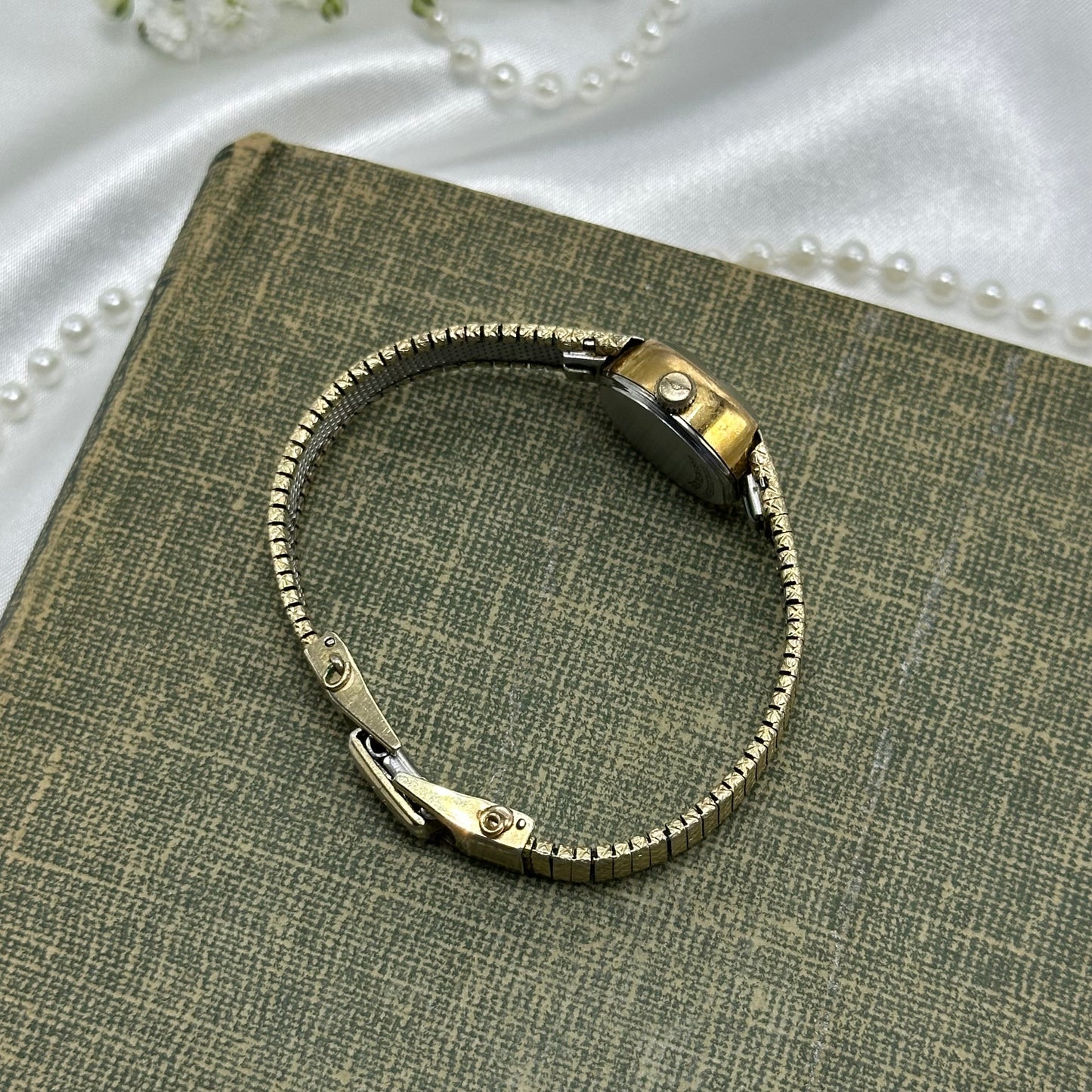 Vintage gold tone dainty watch with black dial quartz movement