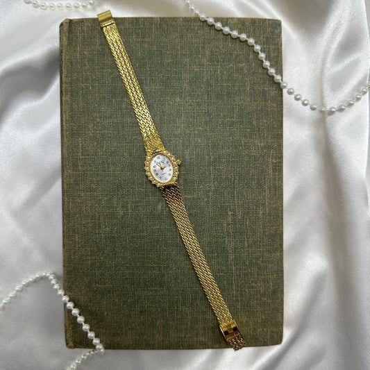 Vintage gold tone diamanté watch with quartz movement and clasp band