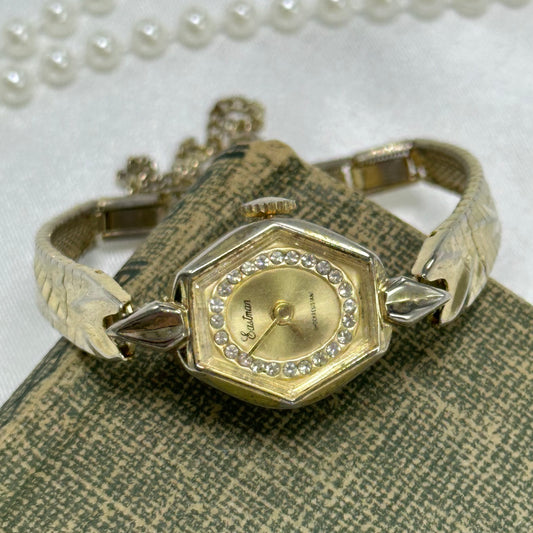 Vintage gold tone manual winding Eastman shock resistant diamanté dial watch with gorgeous detailed clasp band and safety chain.