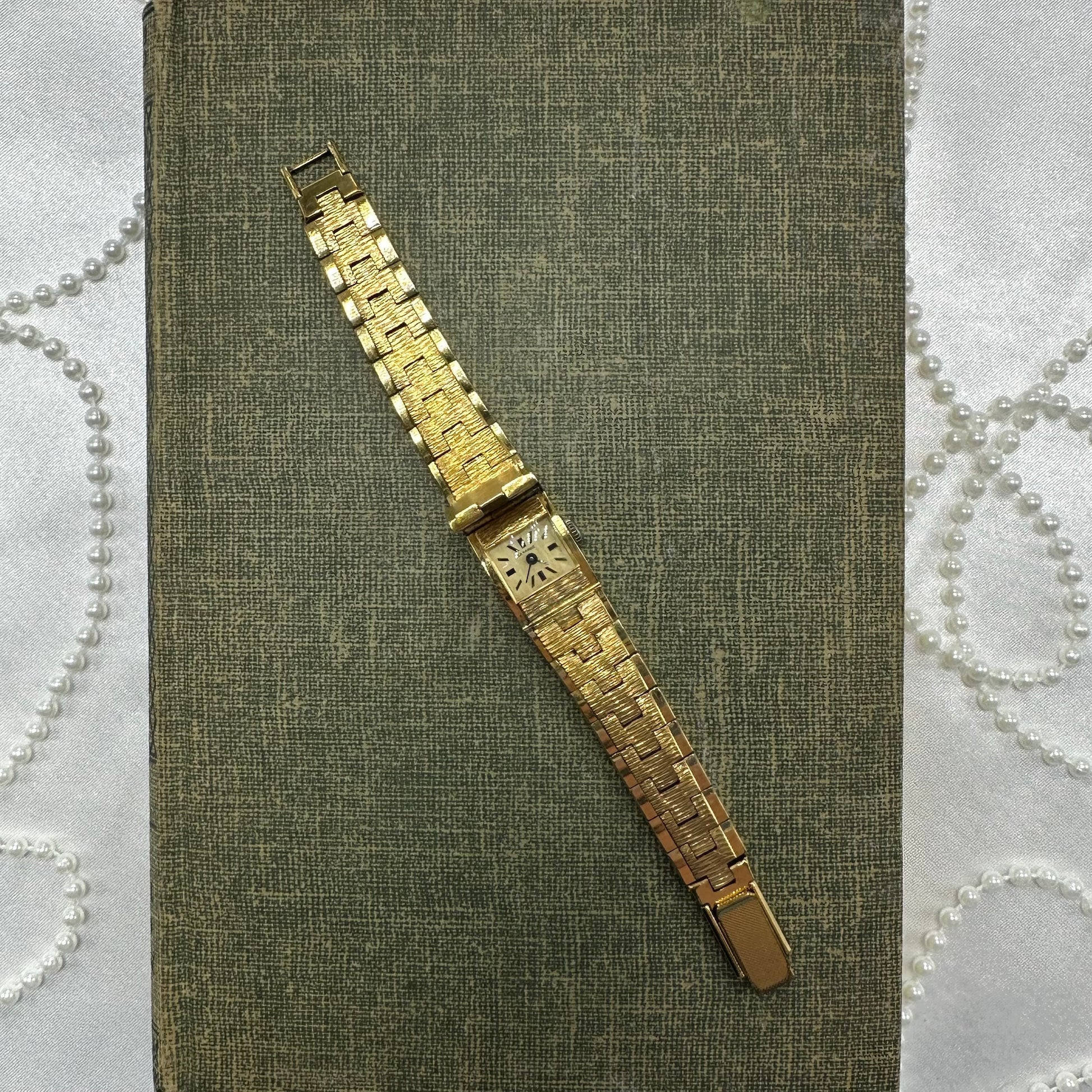 Vintage gold tone manual winding La Marque watch with peek a boo dial