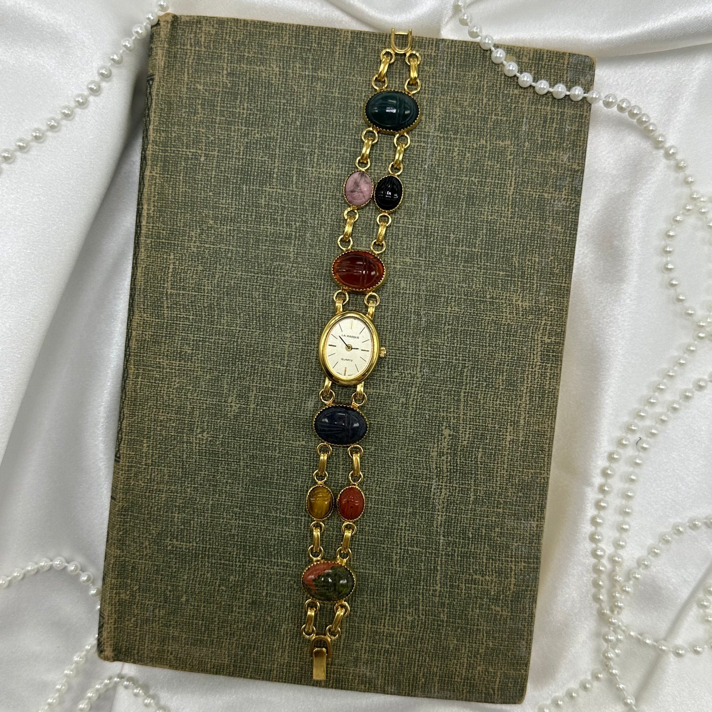 Vintage gold tone scarab watch with quartz movement