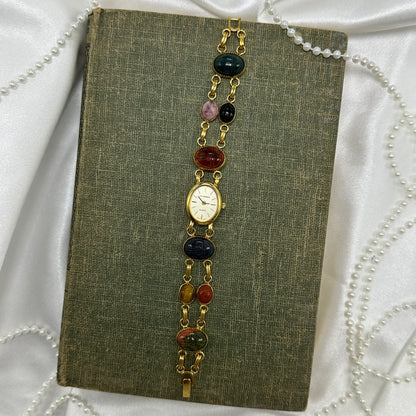 Vintage gold tone scarab watch with quartz movement