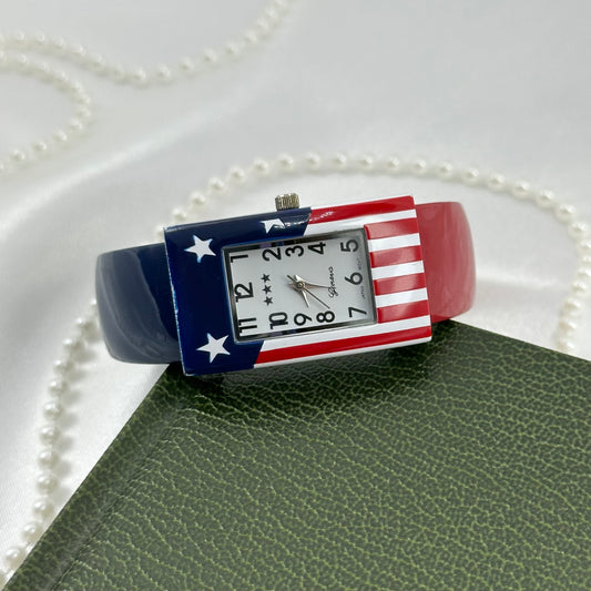 Vintage red, white, and blue Gevena cuff watch with rectangular American flag dial.