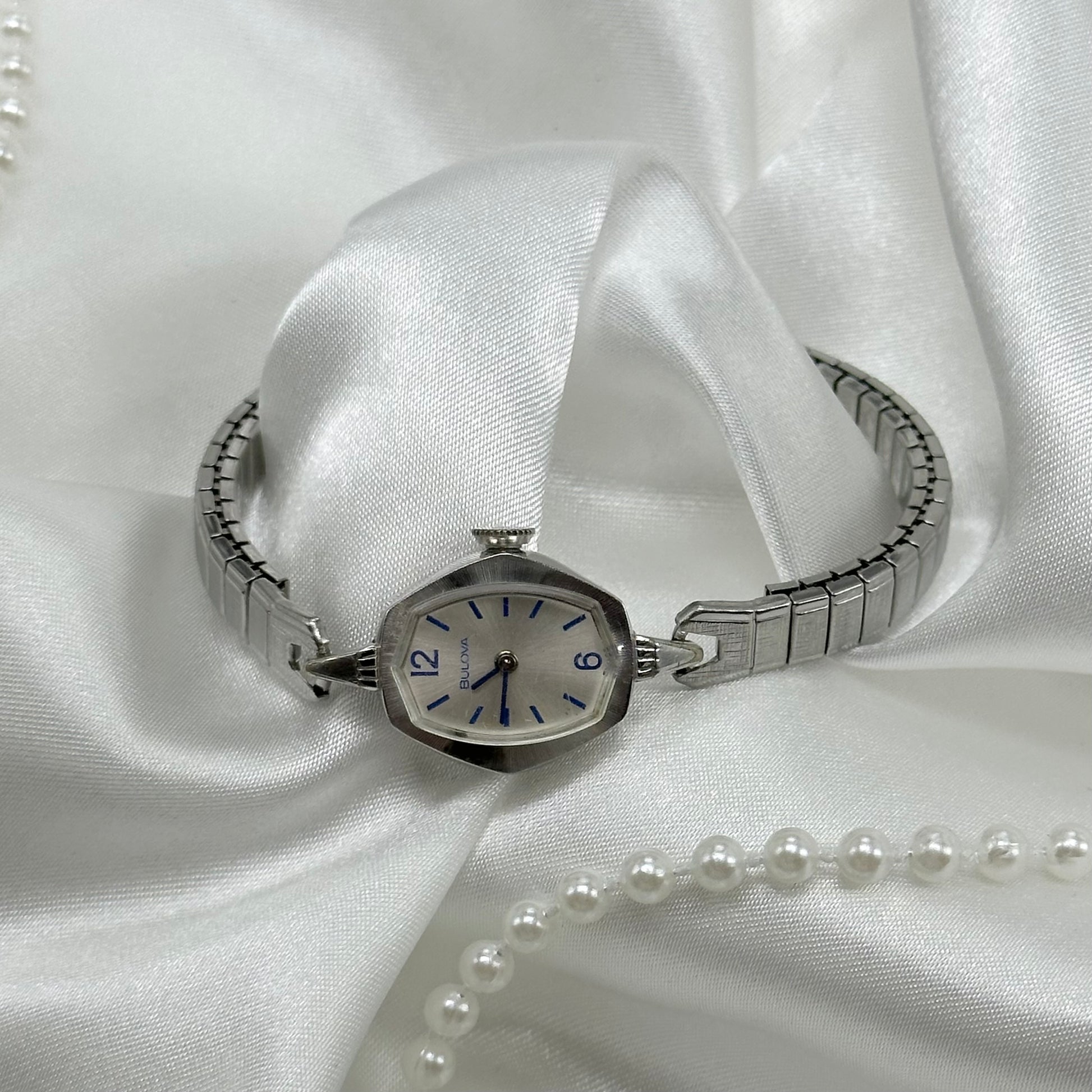 Vintage silver Bulova 10k rolled gold-plated manual winding watch with stretchable band from 1977