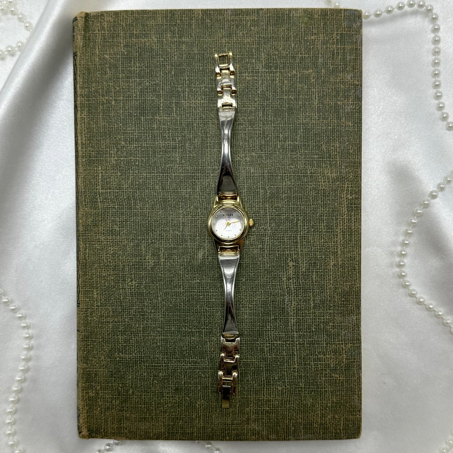 Vintage silver and gold tone Decade watch with with bubble face and quartz movement.