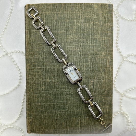Vintage silver and gold tone Premier Designs watch with rectangular dial and chain band.