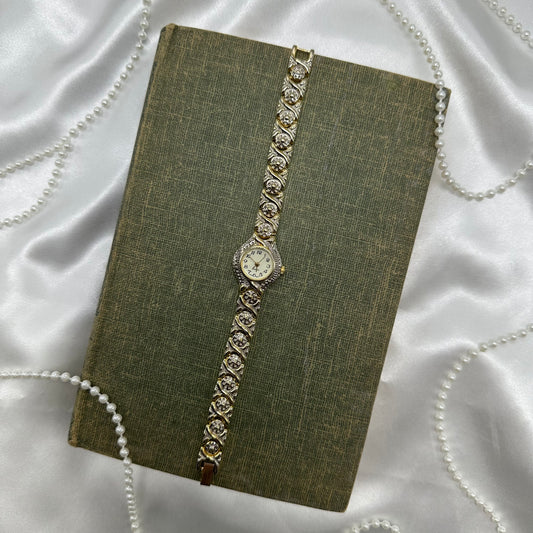Vintage silver and gold tone estate watch with quartz movement.
