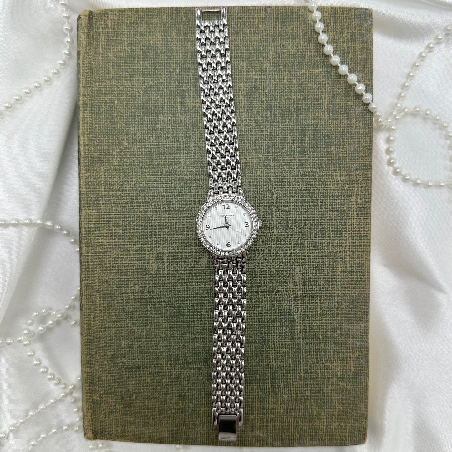 Vintage silver diamanté Daisy Fuentes round dial watch 