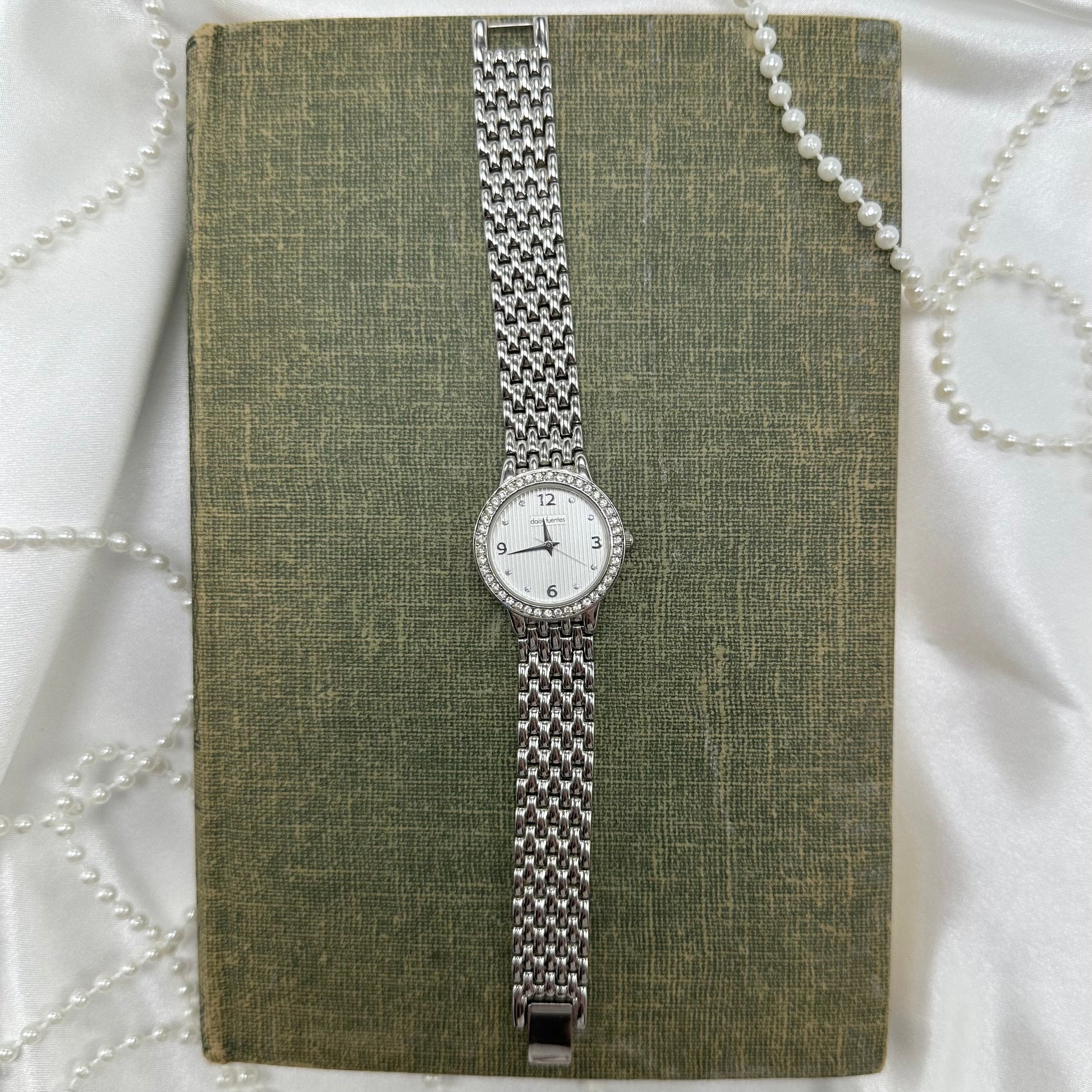 Vintage silver diamanté Daisy Fuentes round dial watch 