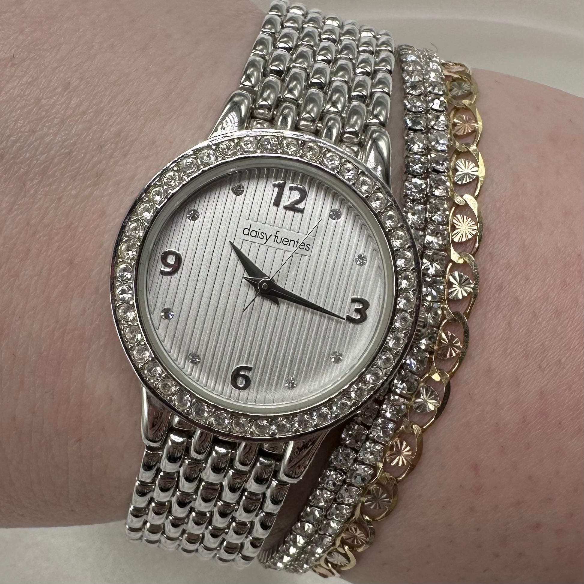 Vintage silver diamanté Daisy Fuentes round dial women's watch 