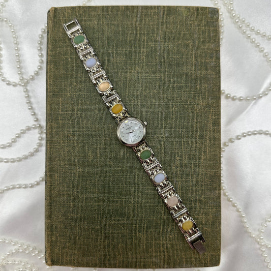 Vintage silver tone LA Express watch with multicolor stone band and quartz movement.