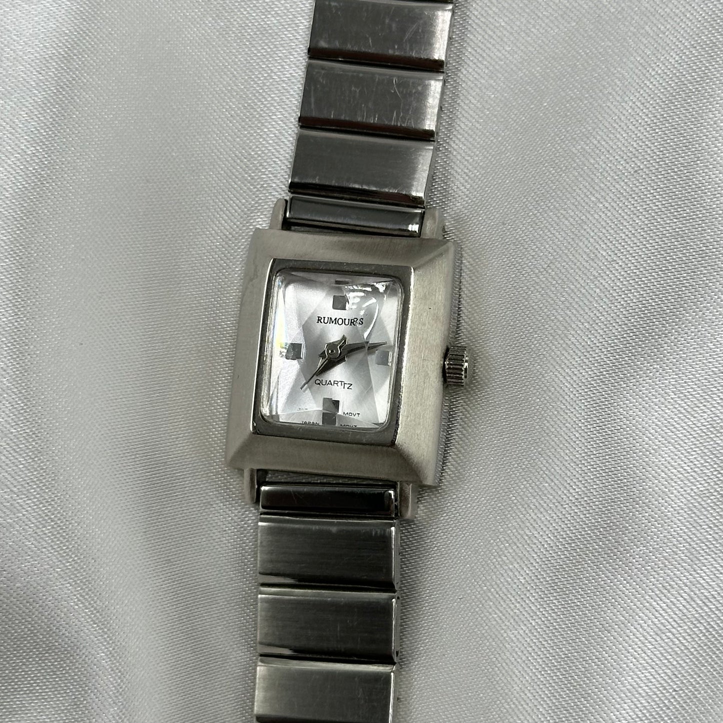 Vintage silver tone Rumours square dial watch with quartz movement 