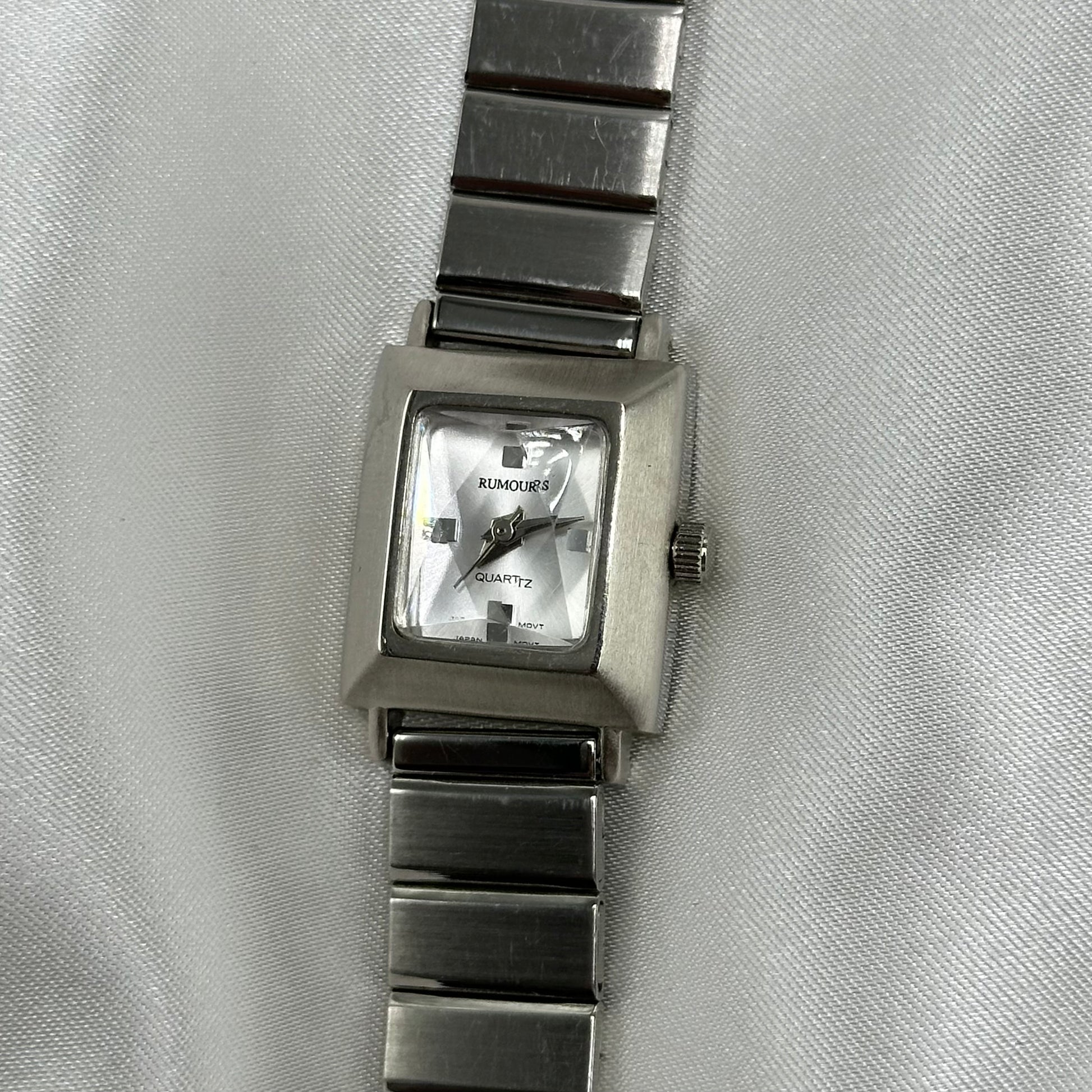 Vintage silver tone Rumours square dial watch with quartz movement 