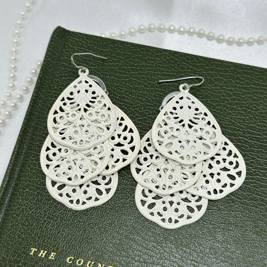 Vintage silver tone and white filigree dangle lightweight earrings.