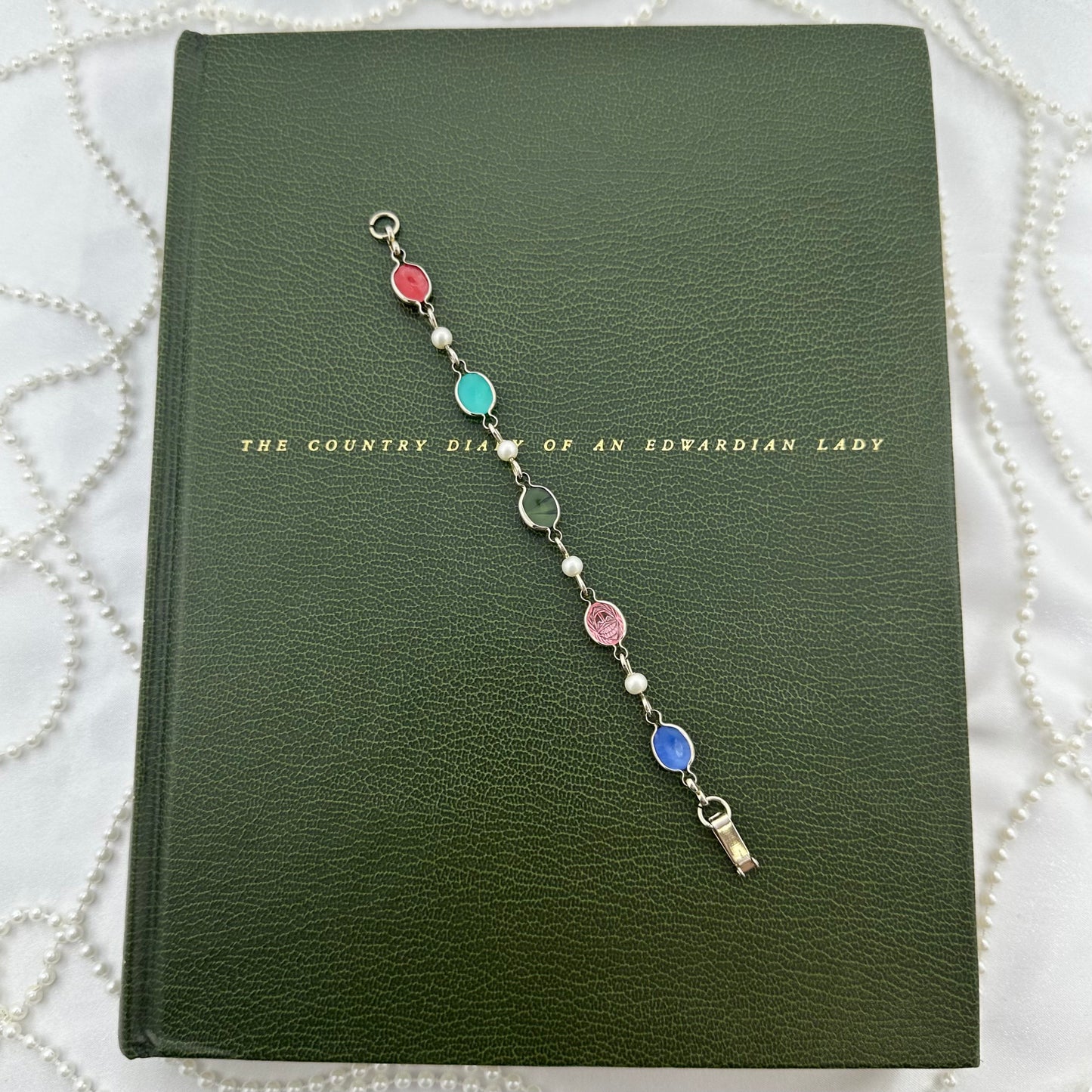 Vintage silver tone bracelet with multicolor scarabs and faux pearls.