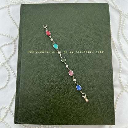 Vintage silver tone bracelet with multicolor scarabs and faux pearls.