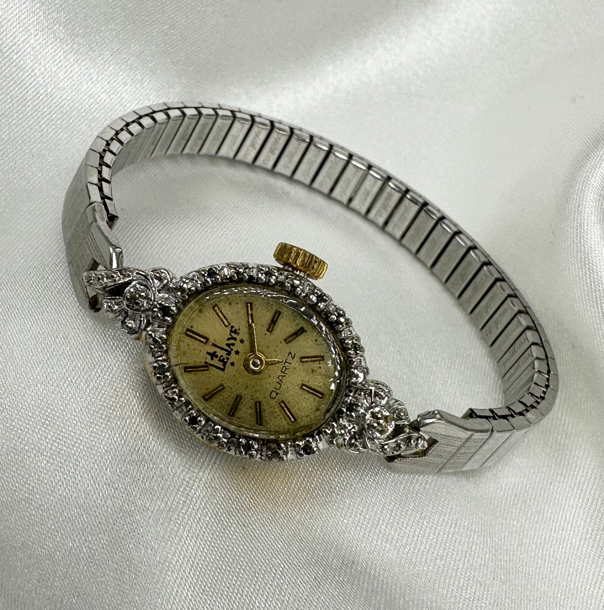 Vintage two-tone LeJaye cocktail watch with quartz movement and stretchable band.