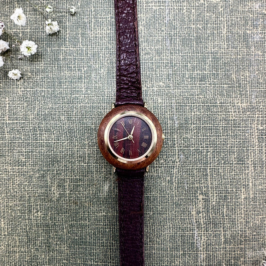 Vintage wood case watch with gold tone accents and quartz movement