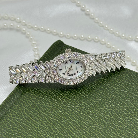 bracelet encrusted with numerous crystals.